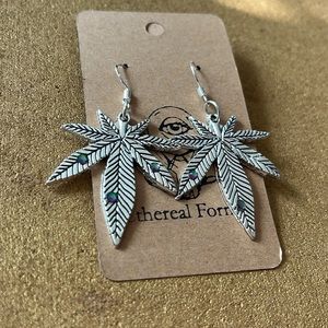 Silver weed leaf dangle earrings with rhinestones